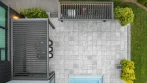 Top view of two louvered roofs: the outdoor kitchen pergola at the top of the patio and the dining pergola beside the house